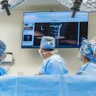 UC Davis Veterinary Medical Teaching Hospital has opened the Center for Advanced Veterinary Surgery. The center offers state-of-the-art operating rooms for orthopedic surgeries. Three orthopedic surgeons examine an x-ray inside the new center. (UC Davis School of Veterinary Medicine)